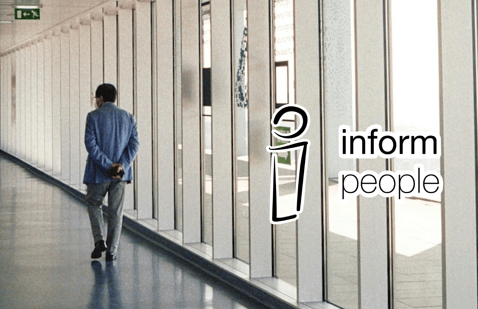 hospital corridor with one person walking away from camera and inform people logo